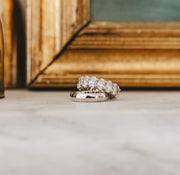 white gold men's band and woman's oval diamond eternity band