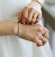 woman wearing custom diamond bracelet and rings