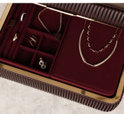 Jewelry set including necklaces and earrings displayed in a red jewelry box.