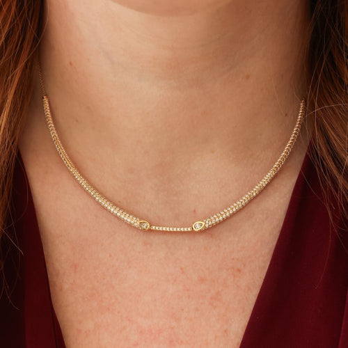 Close up of gold diamond collar necklace