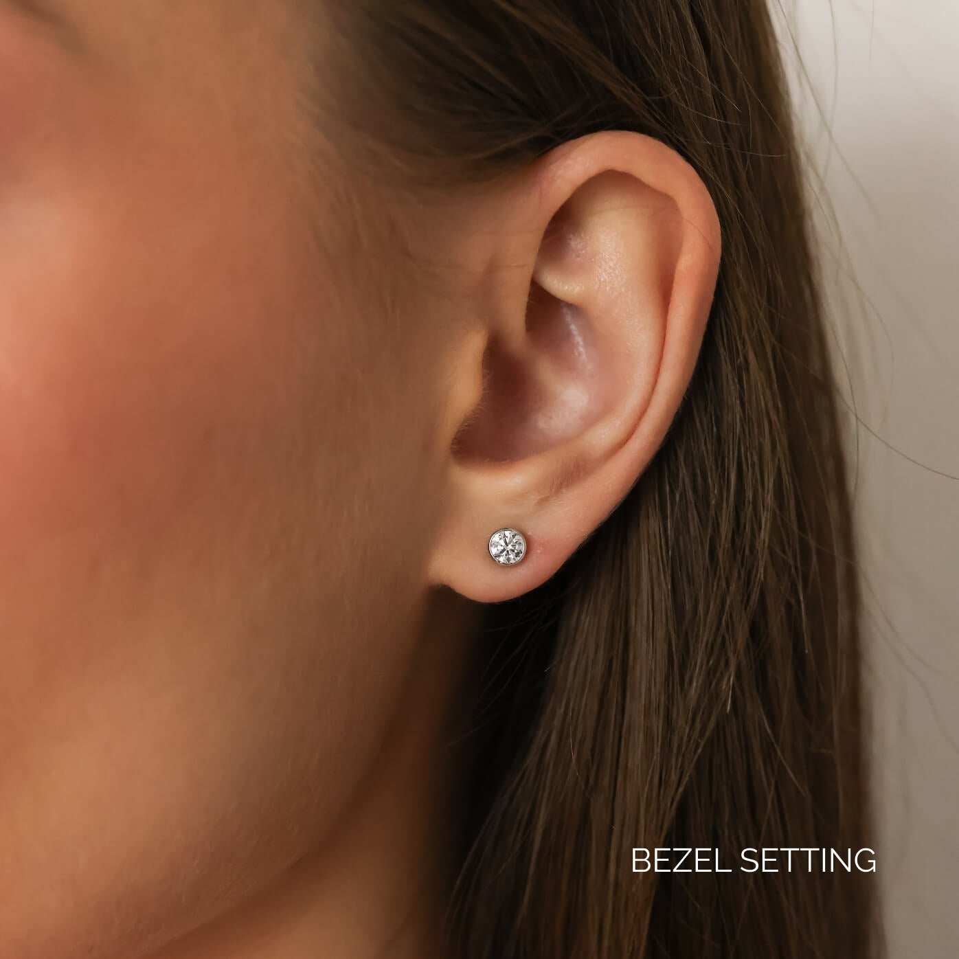 White Gold-9^Diamond Stud Earrings - DRD Diamond Solitaire Studs 0.50 Ct. Total Weight in White Gold. Bezel Setting