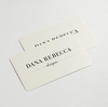 Close up of Dana Rebecca Designs physical gift cards against a white backdrop.
